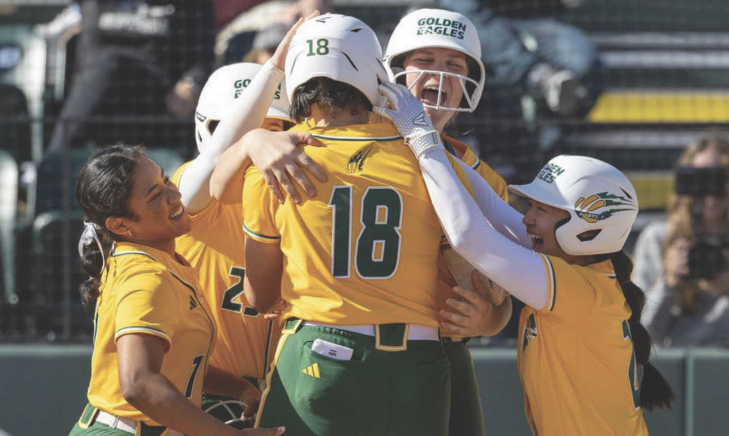 The team celebrates around #18 Missy Nemeth after her home run 